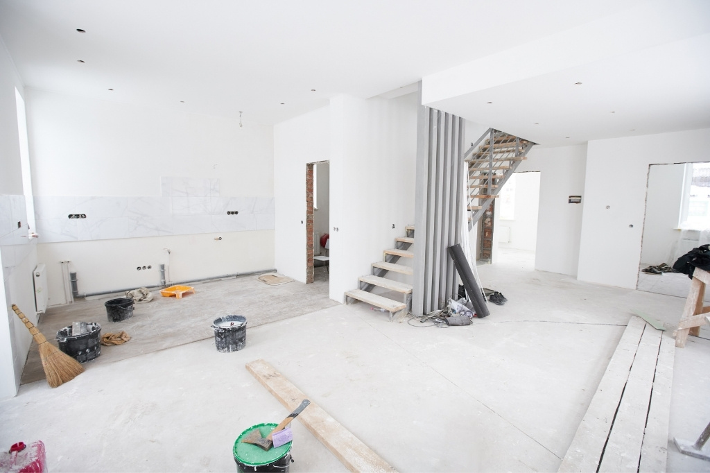Post construction cleaning team removing dust and debris after a home renovation in Connecticut