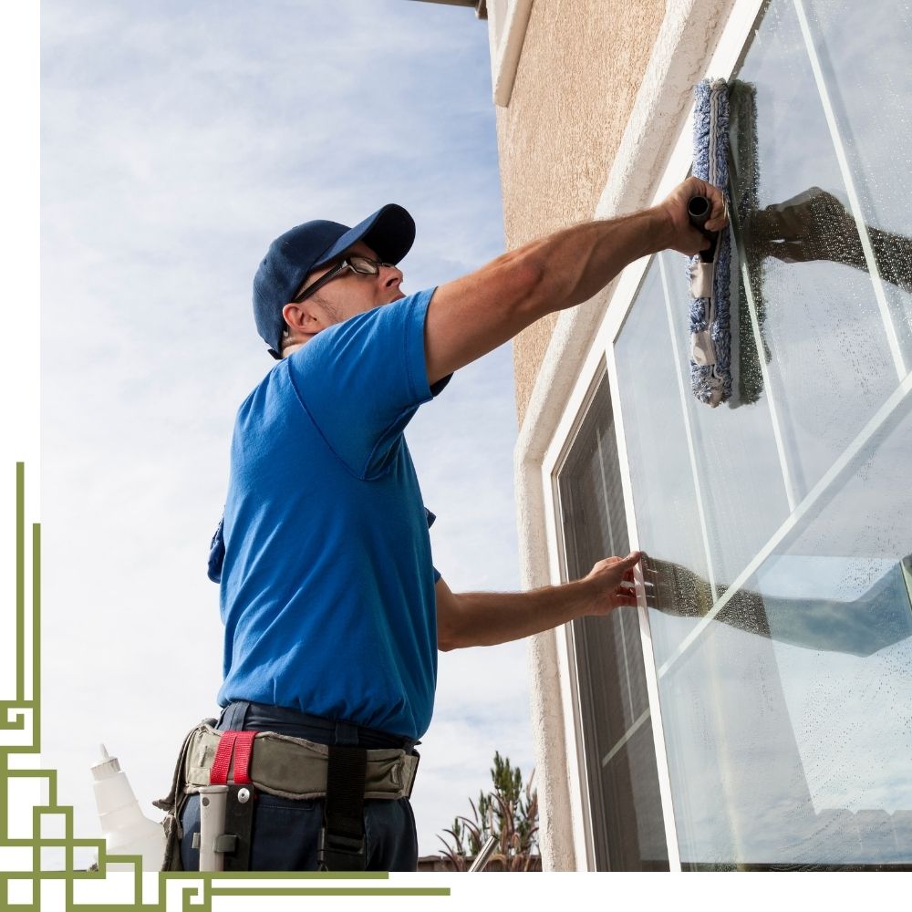 Professional window cleaning service removing dirt and streaks from residential windows in Connecticut